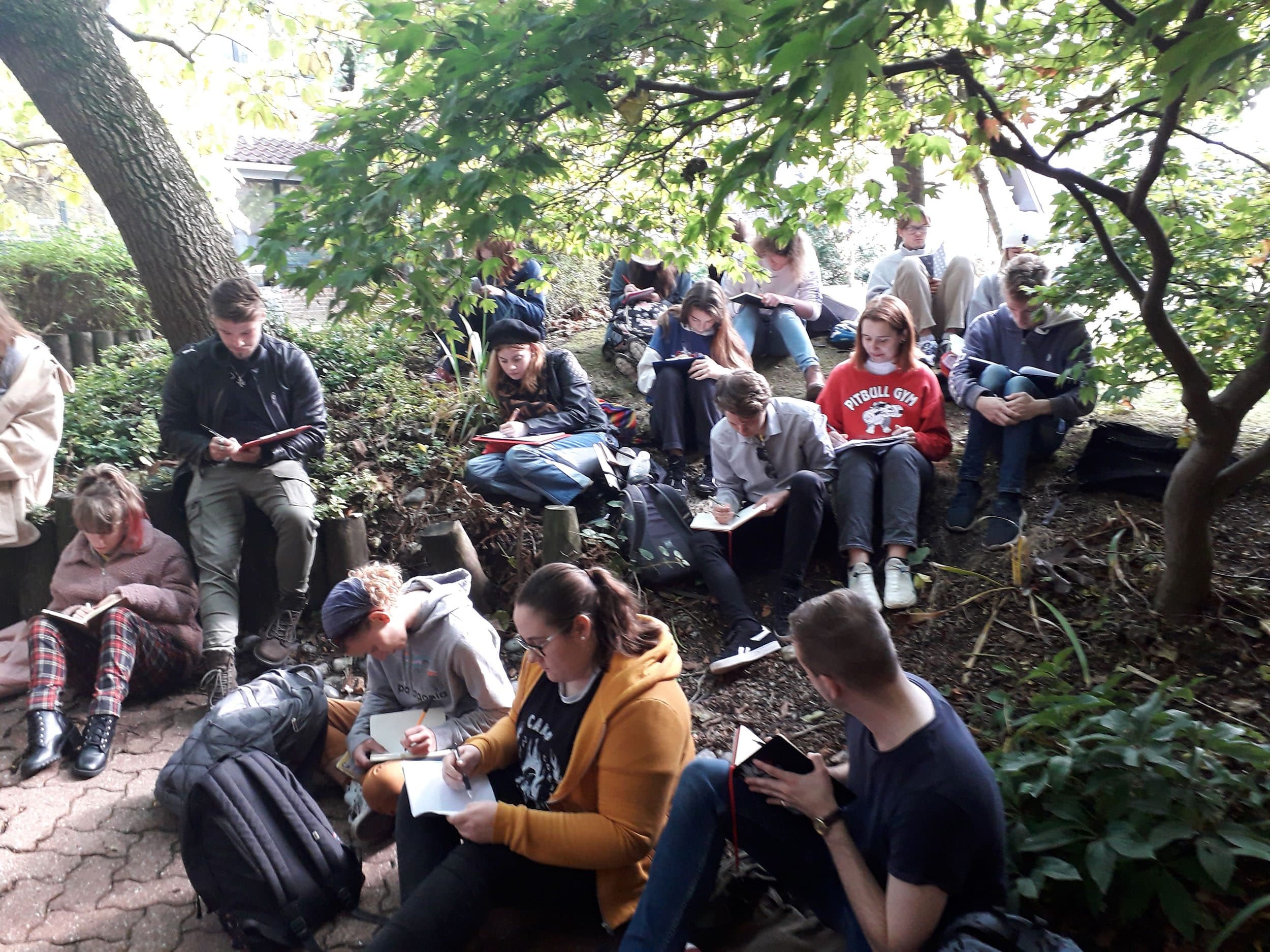 Students sat outside writing